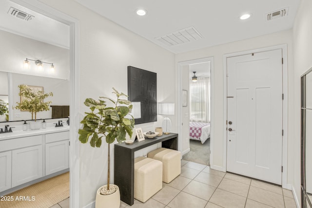 17976 W Ashley Dr, Goodyear, AZ 85338 - entrance foyer with light tile patterned floors, light colored carpet, and recessed lighting