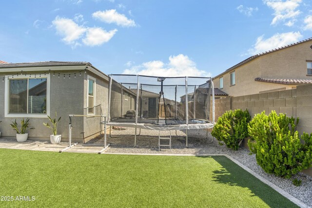 17976 W Ashley Dr, Goodyear, AZ 85338 - fenced backyard with a trampoline