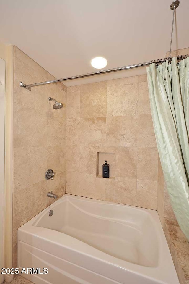 bathroom featuring shower / bath combo with shower curtain