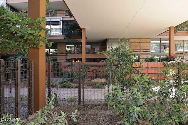 view of gate featuring fence