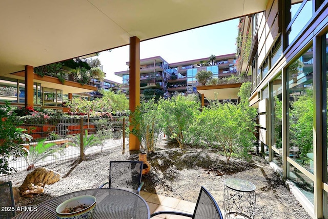 view of patio featuring fence and outdoor dining space