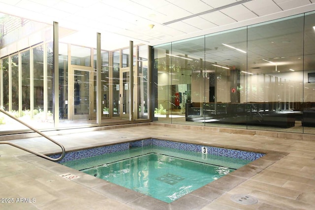 view of swimming pool featuring an indoor in ground hot tub