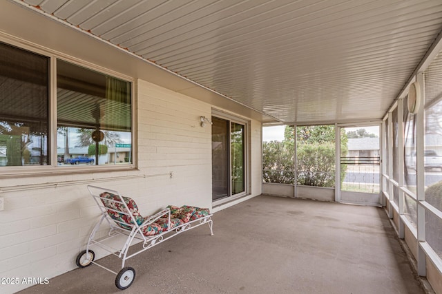 unfurnished sunroom featuring a wealth of natural light