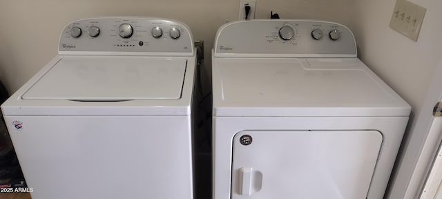 washroom featuring washing machine and clothes dryer