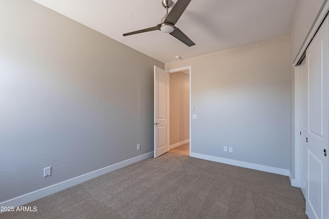 unfurnished bedroom featuring a closet, carpet, baseboards, and ceiling fan
