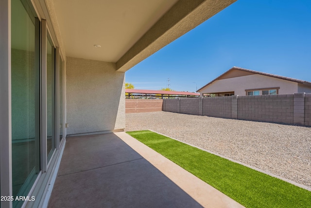 fenced backyard featuring a patio