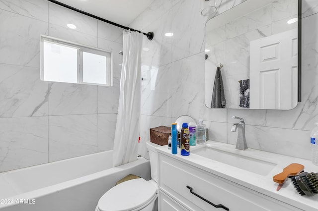 full bathroom featuring tile walls, shower / tub combo, vanity, tasteful backsplash, and toilet