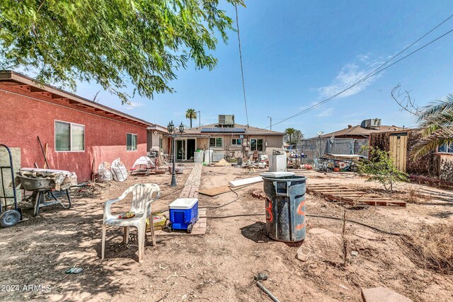 back of house with a patio