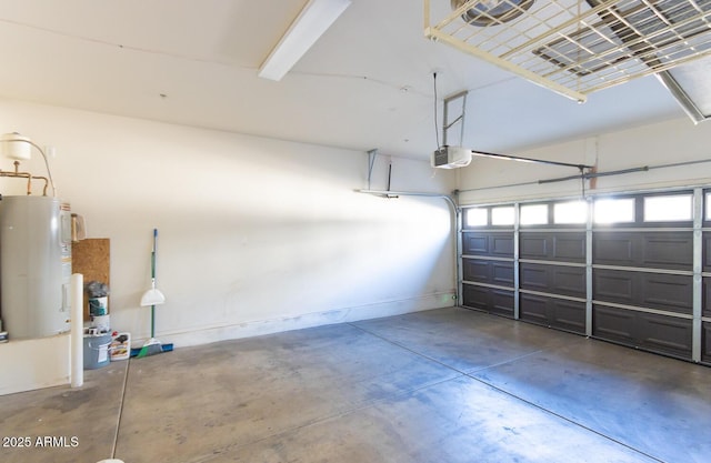 garage with a garage door opener and electric water heater