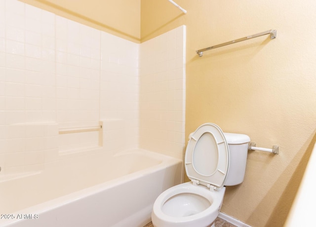 bathroom with toilet and shower / bath combination