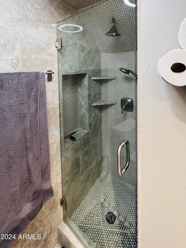 bathroom featuring an enclosed shower