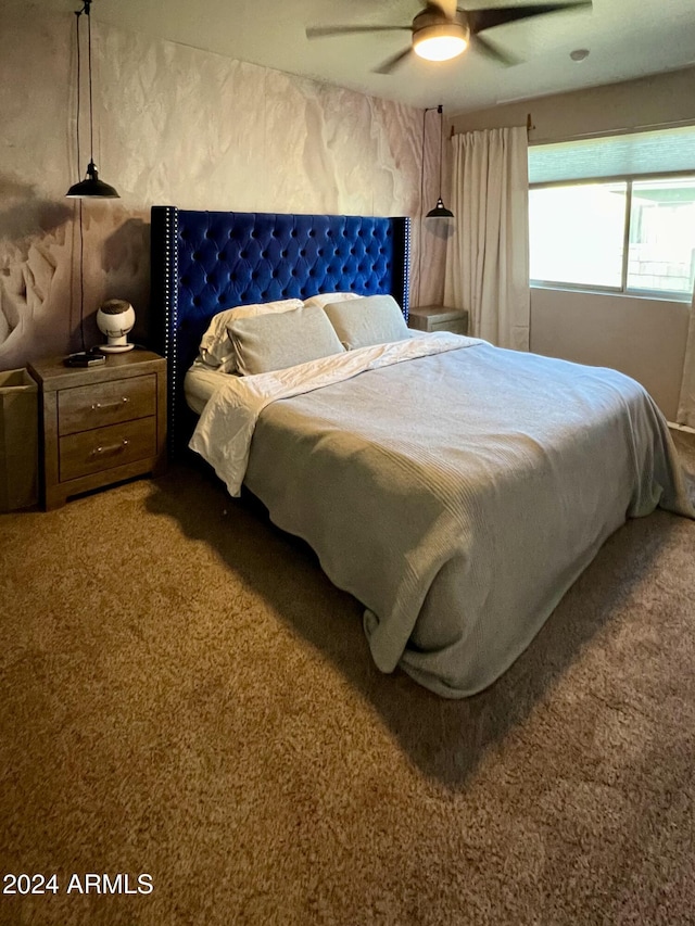 bedroom featuring ceiling fan and carpet floors