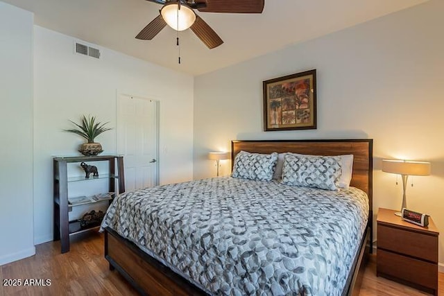 5335 E Shea Blvd Unit 2081, Scottsdale, AZ 85254 - bedroom with wood finished floors, baseboards, and a ceiling fan