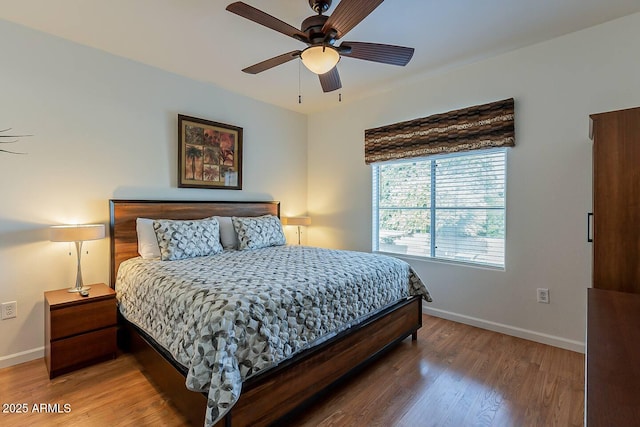 5335 E Shea Blvd Unit 2081, Scottsdale, AZ 85254 - bedroom with baseboards, wood finished floors, and a ceiling fan