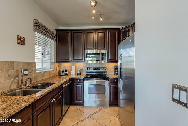 5335 E Shea Blvd Unit 2081, Scottsdale, AZ 85254 - kitchen featuring stainless steel appliances, a sink, decorative backsplash, and light tile patterned floors