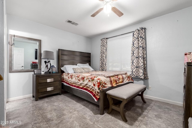 bedroom with ceiling fan, visible vents, and baseboards