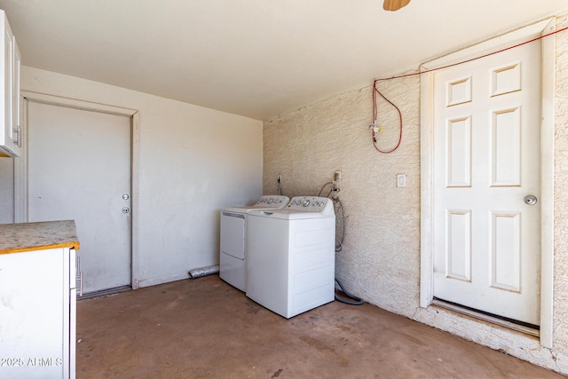 laundry room with independent washer and dryer and cabinet space