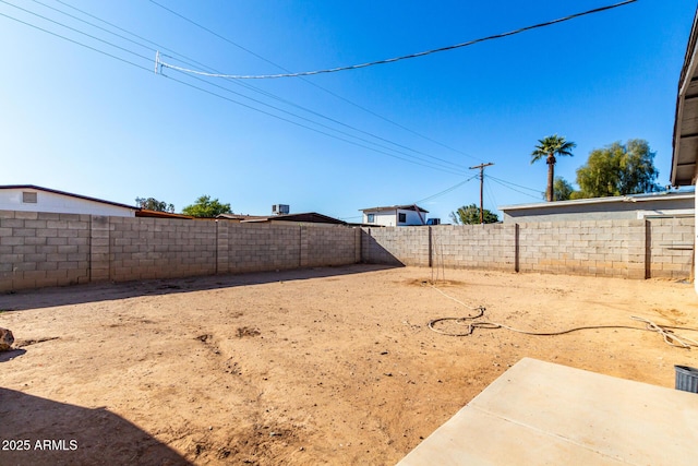 view of yard with a fenced backyard