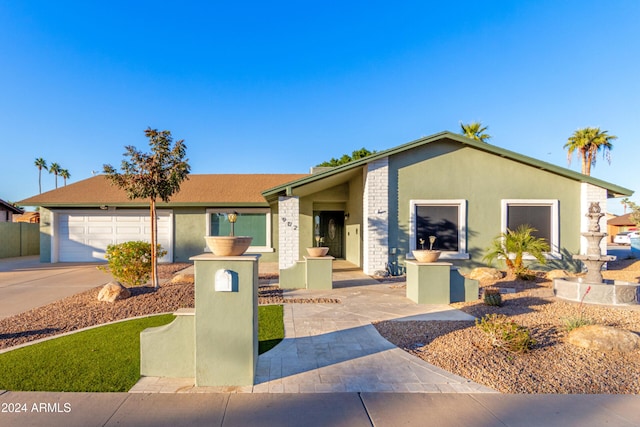 single story home with a garage