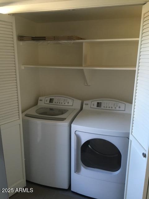 laundry area with separate washer and dryer