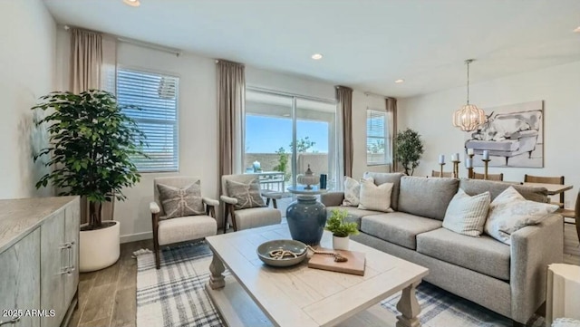 1516 W Ridge Rd, Apache Junction, AZ 85120 - living area featuring light wood-type flooring, plenty of natural light, recessed lighting, a chandelier, and baseboards
