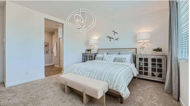 1516 W Ridge Rd, Apache Junction, AZ 85120 - carpeted bedroom featuring a chandelier and baseboards