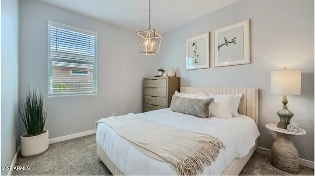 1516 W Ridge Rd, Apache Junction, AZ 85120 - carpeted bedroom featuring baseboards and a chandelier