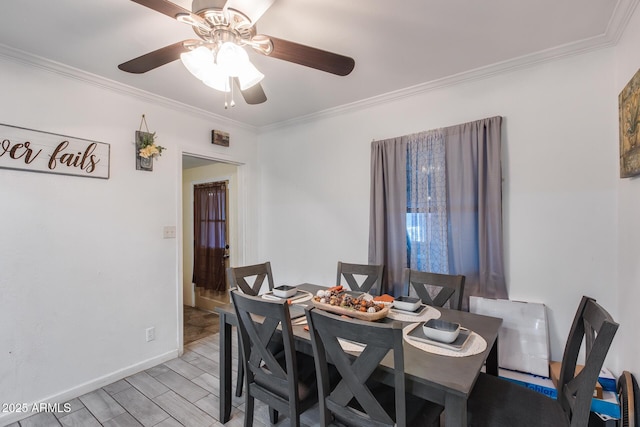 dining space featuring crown molding, ceiling fan, and light hardwood / wood-style floors