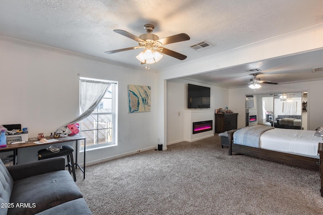 carpeted bedroom with ceiling fan, crown molding, and a textured ceiling