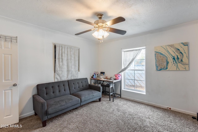 living room with ceiling fan, crown molding, carpet floors, and a textured ceiling