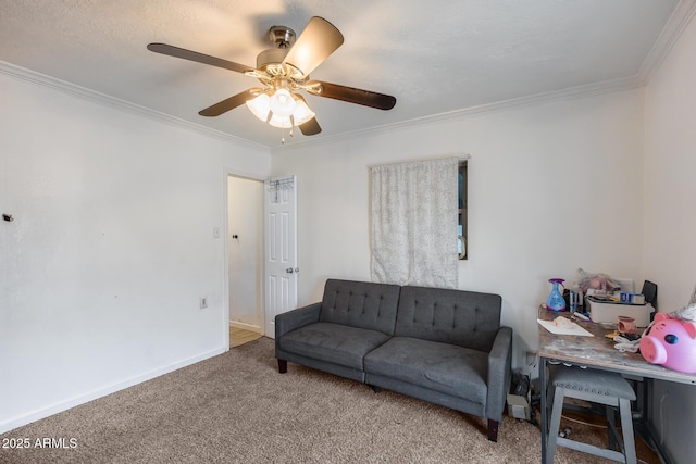 living room with ornamental molding, ceiling fan, and carpet flooring