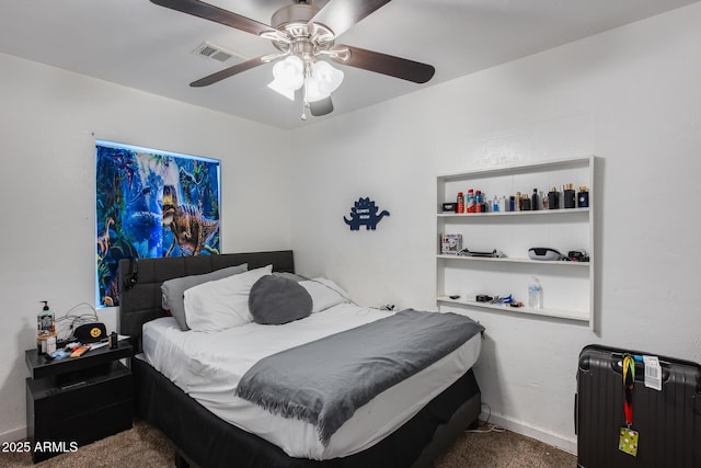 carpeted bedroom with radiator and ceiling fan