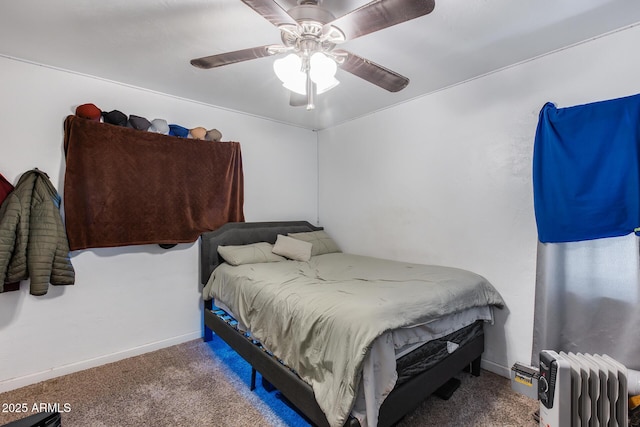 bedroom featuring carpet, radiator, and ceiling fan