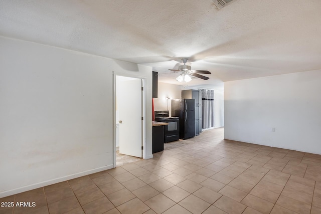 unfurnished living room with ceiling fan and a textured ceiling