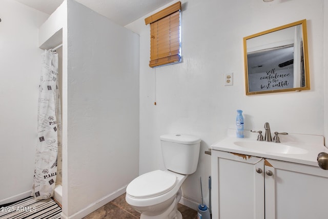 bathroom featuring a shower with curtain, vanity, and toilet