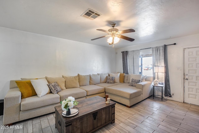 living room with ceiling fan