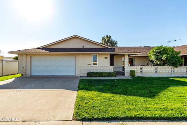 single story home with a front lawn, a porch, and a garage