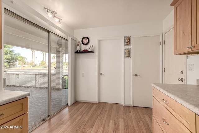 kitchen featuring light brown cabinets and light hardwood / wood-style floors