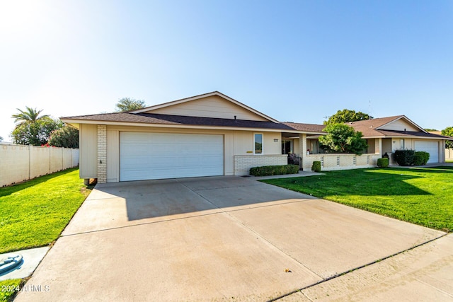 single story home with a front lawn and a garage