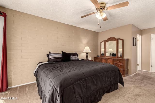 bedroom with carpet, a textured ceiling, and ceiling fan