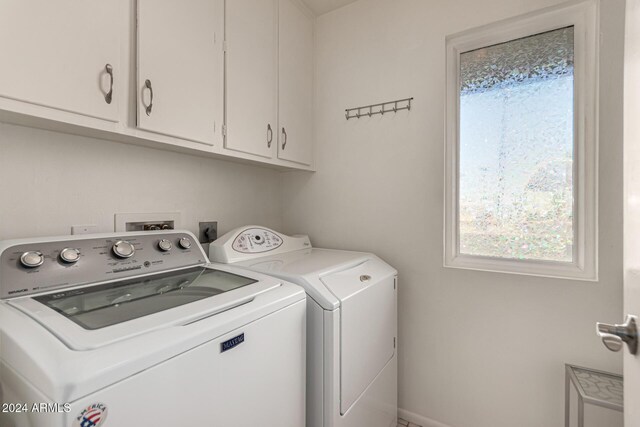 laundry room featuring cabinets and independent washer and dryer