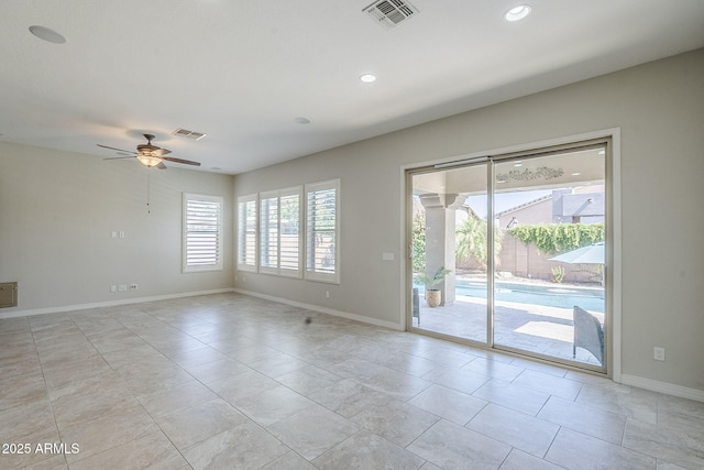 spare room featuring ceiling fan, baseboards, recessed lighting, and light tile patterned floors
