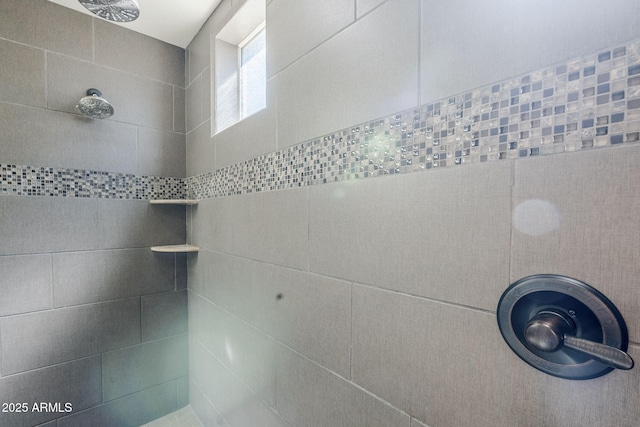 bathroom view of tiled shower