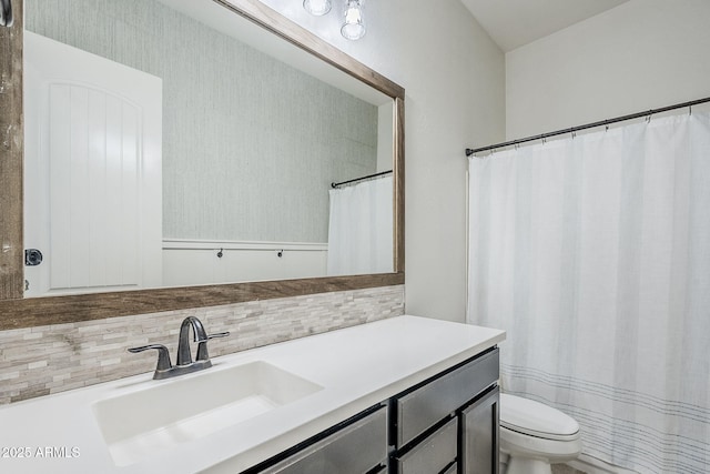 full bath featuring tasteful backsplash, toilet, and vanity