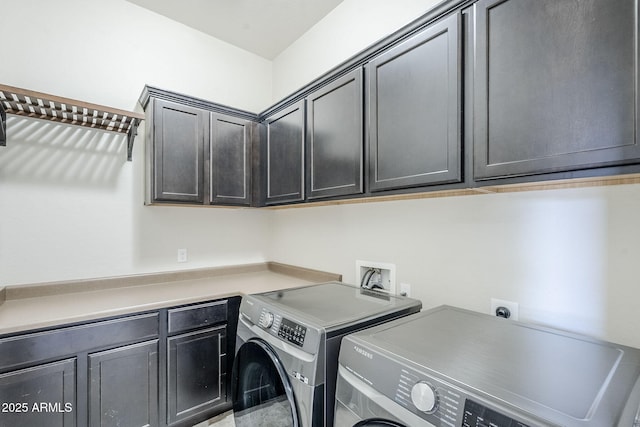 laundry room featuring washer and dryer and cabinet space