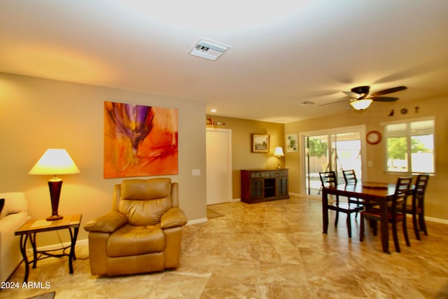 dining room featuring ceiling fan