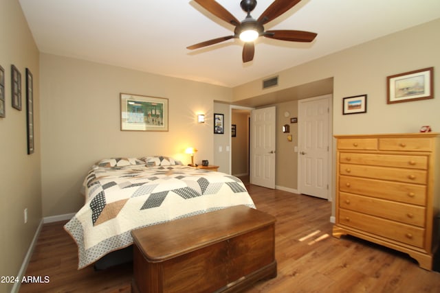 bedroom featuring ceiling fan and wood-type flooring