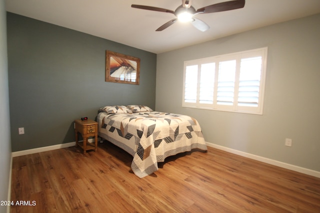 bedroom featuring wood-type flooring and ceiling fan