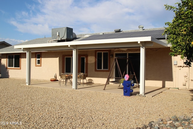 back of house with a patio and central air condition unit