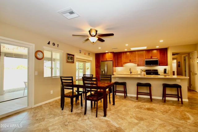 dining space with ceiling fan